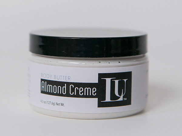 Almond Crème Body Butter jar with black lid and LU label